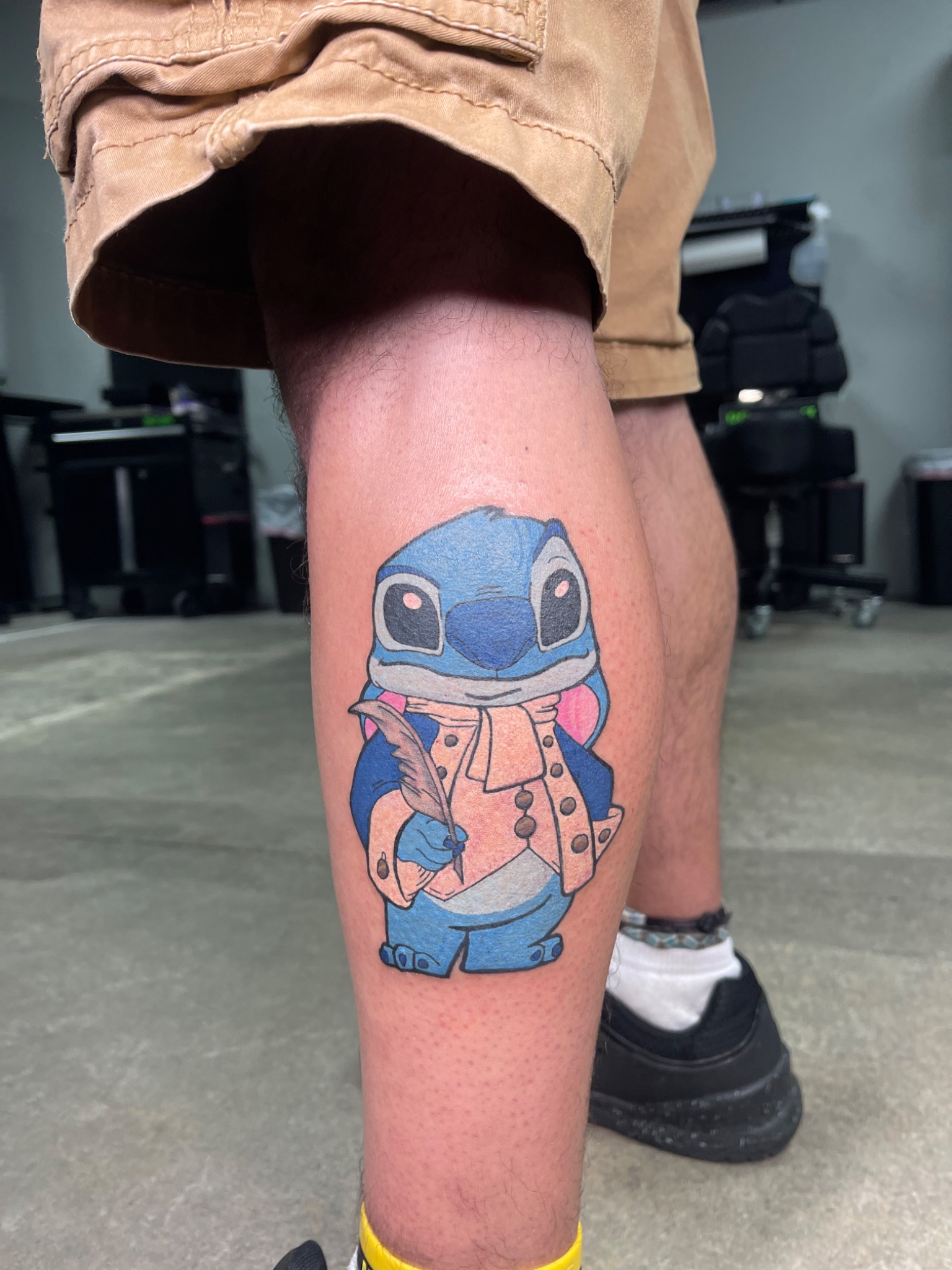 Full view of colorful Stitch tattoo