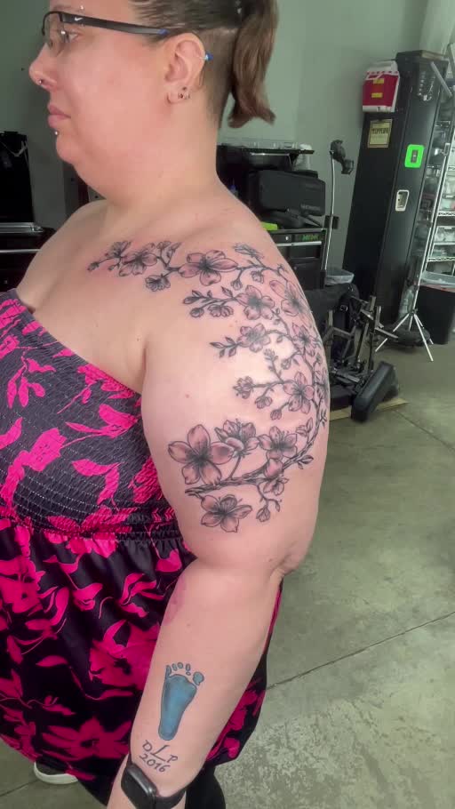 Fine-line floral shoulder tattoo