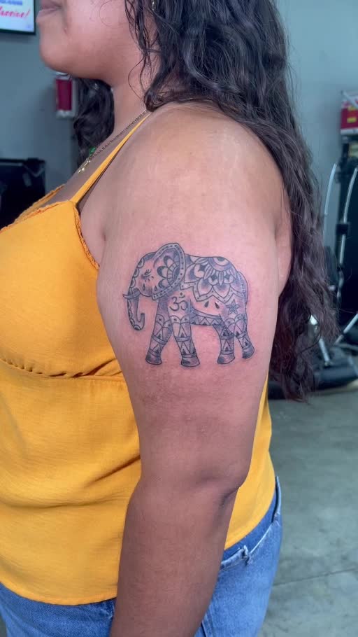 Detailed elephant upper-arm tattoo