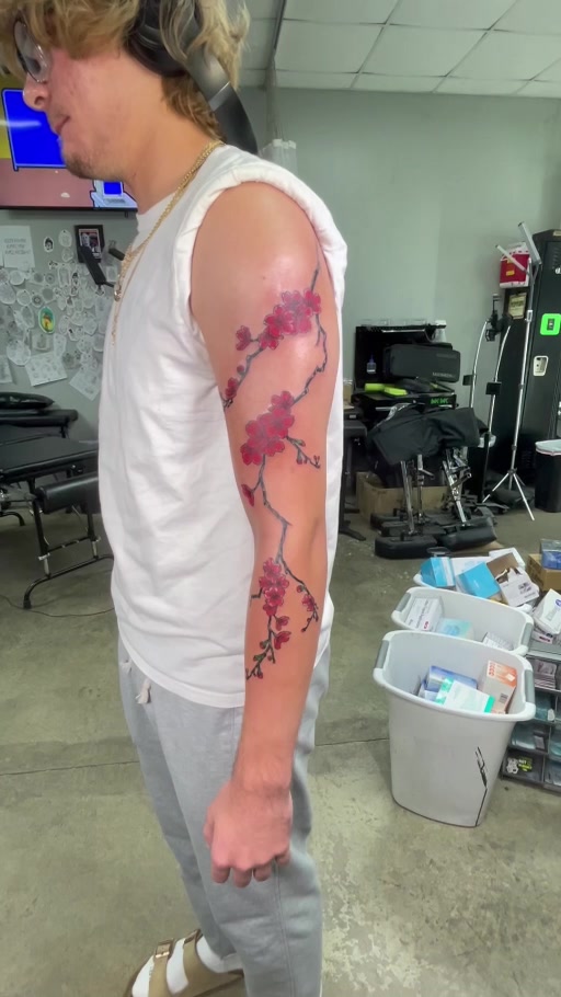 Large color cherry blossom arm tattoo