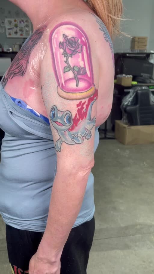 Full color storybook character upper-arm tattoo